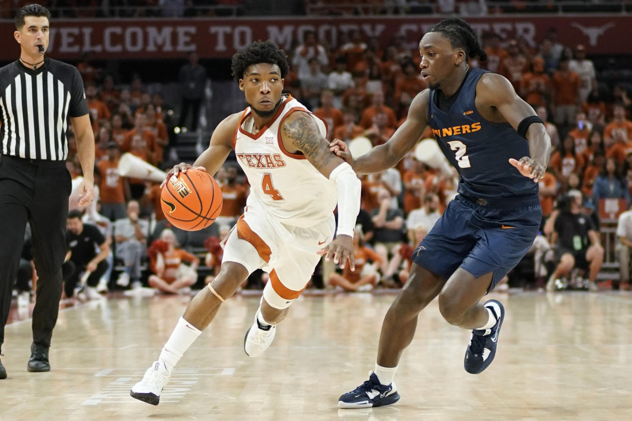 Texas guard Tyrese Hunter drives to the basket against the UTEP guard Tae Hardy during the second half of their season opener at Moody Center in Austin, Texas, on Nov. 7, 2022. (Scott Wachter/USA TODAY Sports)