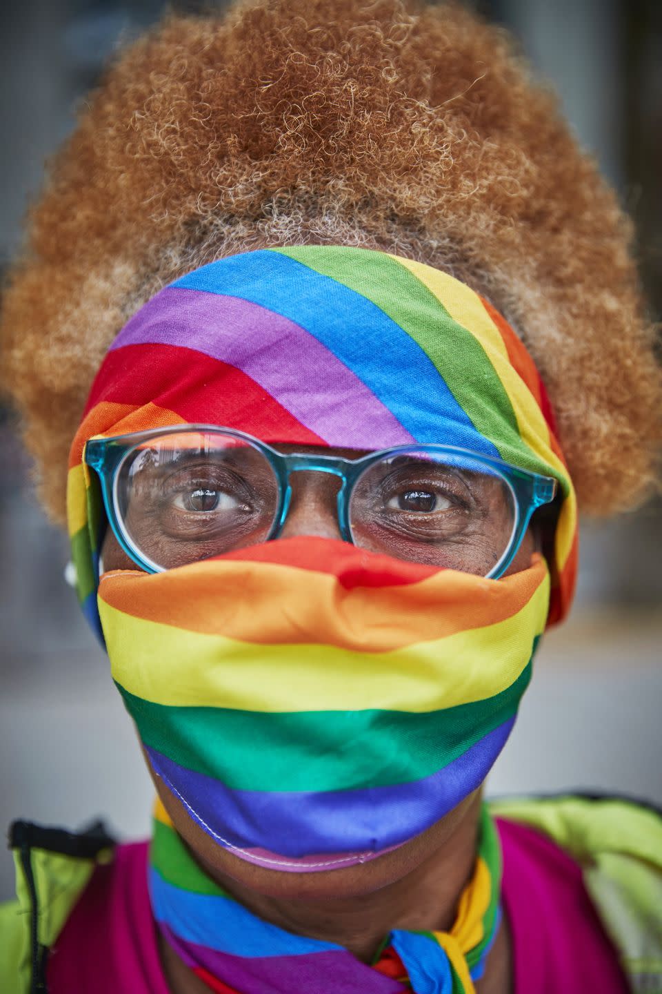 <p>One LGBTQ+ supporter stays safe in the Paris march with an aptly rainbow coloured mask.</p>