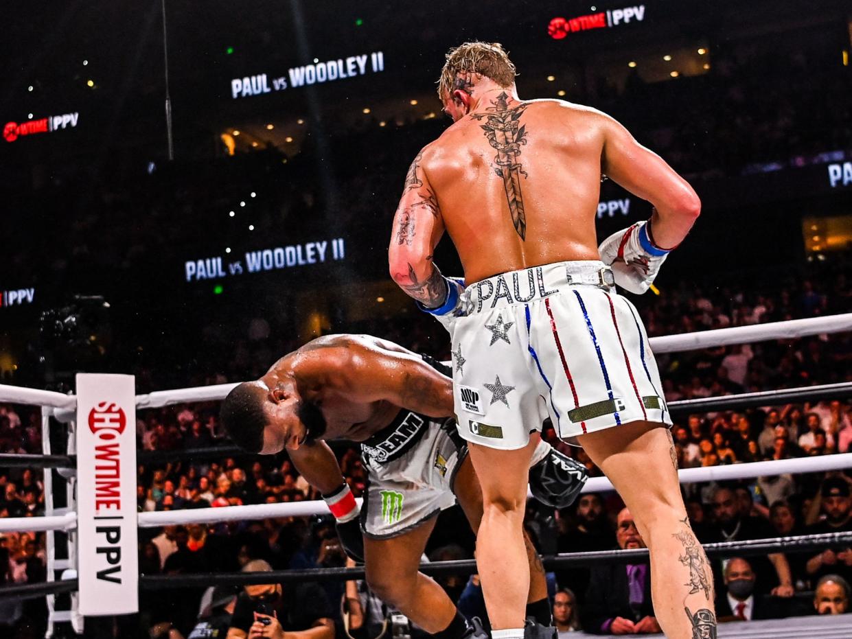 Jake Paul knocking out Tyron Woodley in their rematch in 2021 (AFP via Getty Images)