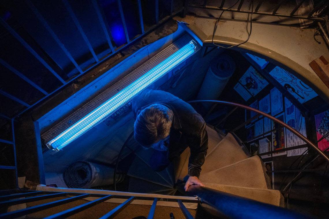 From backstage, the performers, stage personnel and even the show’s director Joe Fox, shown here, must take a narrow spiral staircase to get to the stage at New Theatre.