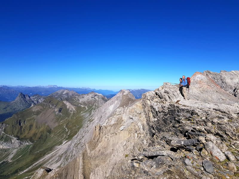 Researchers Martin Sander and Michael Hautmann look over the geological layers in the Swiss High Alps