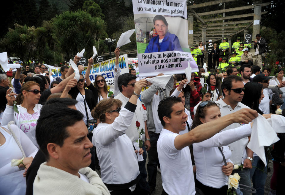 People march at Bogota's National Park on June 3, 2012 to reject the brutal torture, rape and murder of thirty-five-year-old Rosa Elvira Cely.