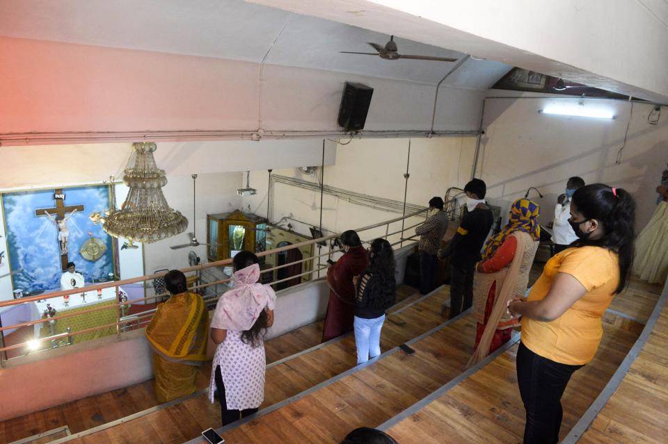 Catholic devotees pray in the Saint Anthony's Shrine after places of religious worship, hotels, restaurants and shopping malls are allowed to operate again following more than two months of lockdown imposed as a preventive measure against the COVID-19 coronavirus in Hyderabad on June 9, 2020. (Photo by Noah SEELAM / AFP) (Photo by NOAH SEELAM/AFP via Getty Images)