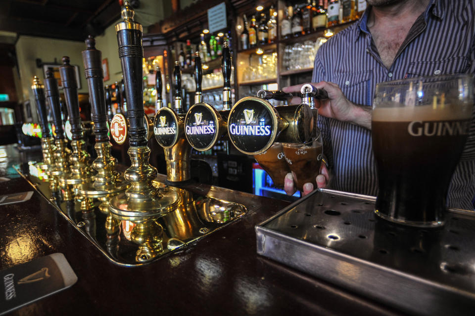  A bartender pulls two pints of Guinness at the bar in MB.SLATTERY�S, a traditional Dublin pub located in the heart of Rathmines that has been in the Slattery family for two generations. On Monday, April 3, 2017, in Rathmines, Dublin, Ireland. Photo by Artur Widak *** Please Use Credit from Credit Field *** 