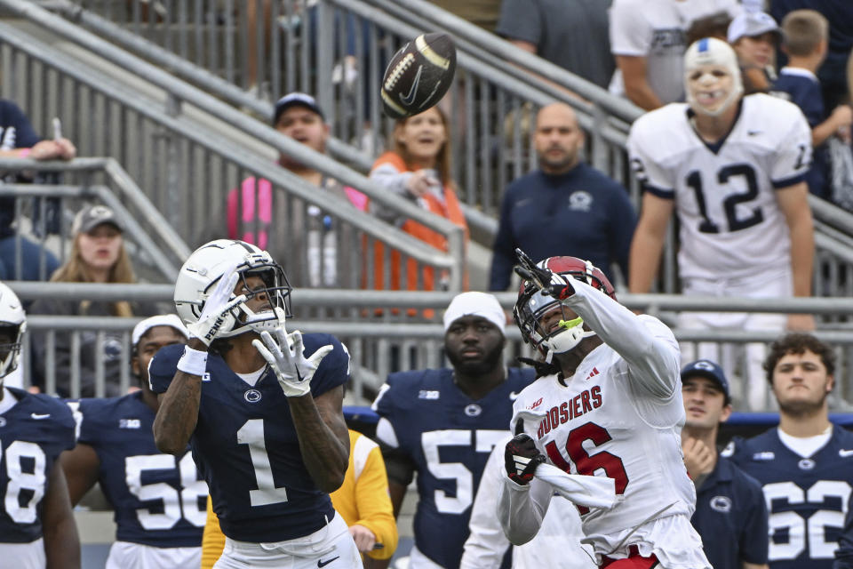 Penn State wide receiver KeAndre Lambert-Smith (1) catches a touchdown pass in front of Indiana defensive back Jordan Grier (16) during the second half of an NCAA college football game, Saturday, Oct. 28, 2023, in State College, Pa. (AP Photo/Barry Reeger)