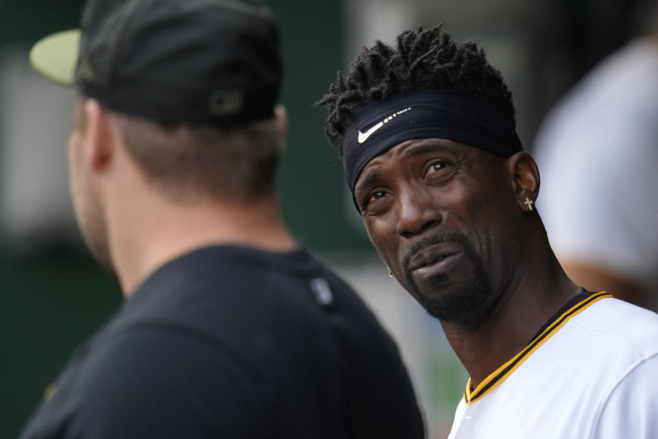 Pittsburgh Pirates' Andrew McCutchen, right, talks with David Bednar in the dugout during a baseball game against the Oakland Athletics in Pittsburgh, Monday, June 5, 2023. (AP Photo/Gene J. Puskar)