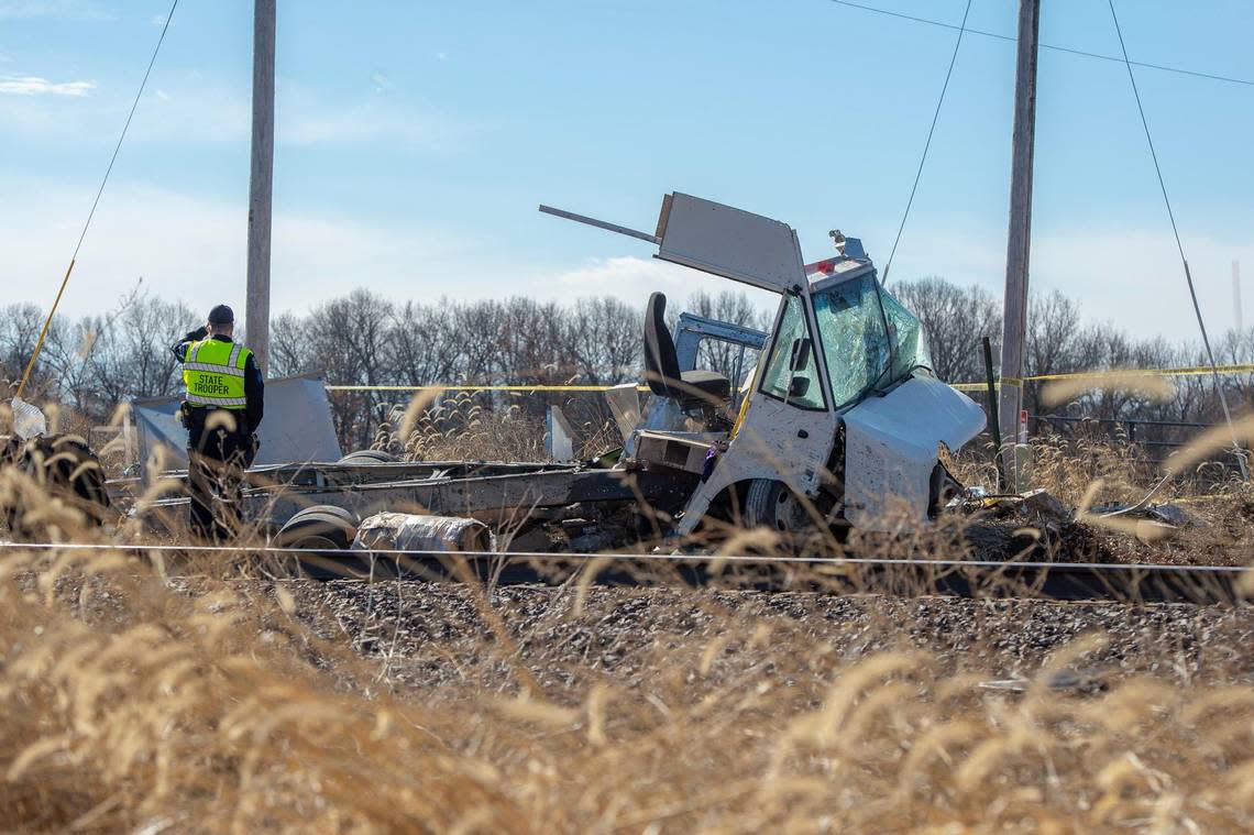 First responders investigated the scene where a FedEx truck collided with an Amtrak train on a crossing near Smart Road and Hereford Road on Tuesday, Feb. 7, 2023, near Pleasant Hill, Mo.