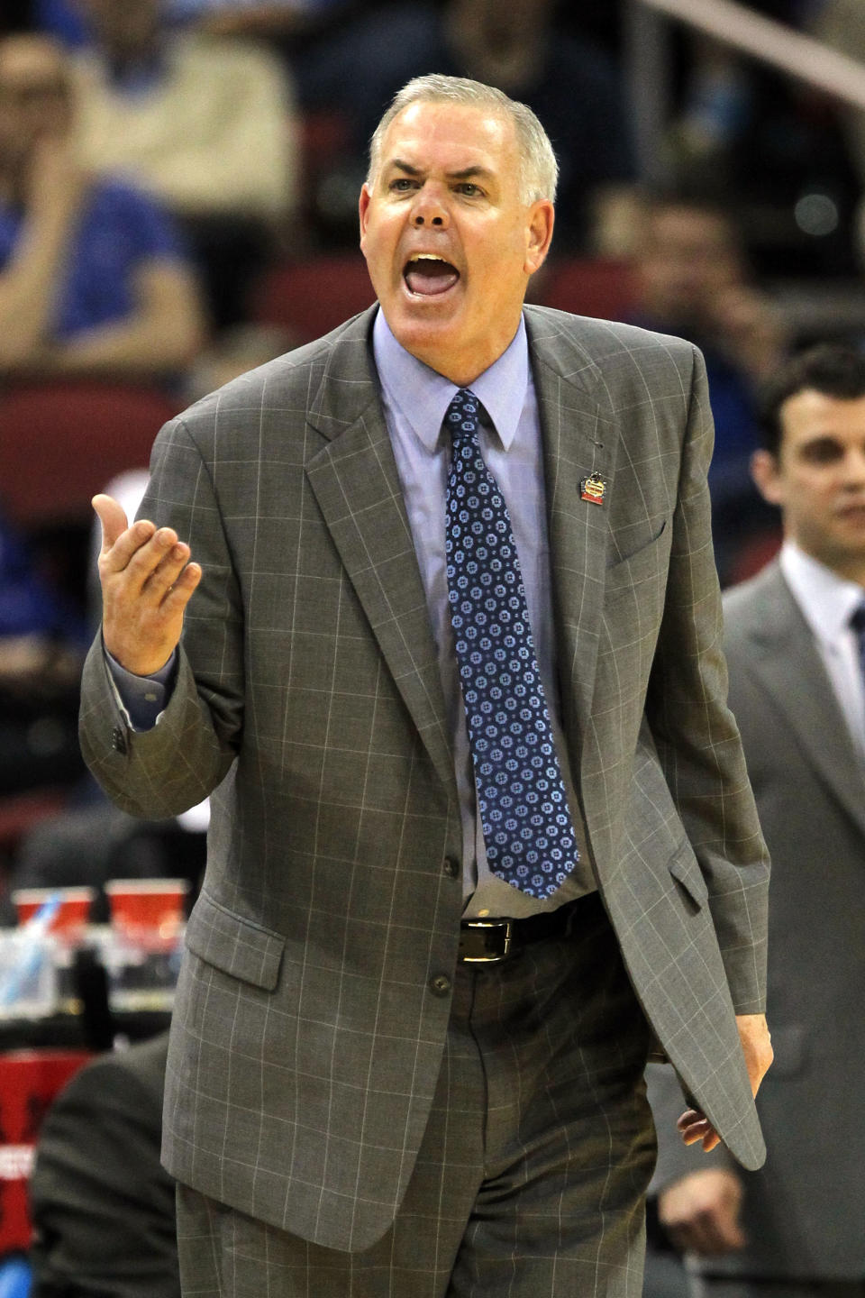 Head coach Dave Rose of the Brigham Young Cougars shouts from the sidelines against the Marquette Golden Eagles during the second round of the 2012 NCAA Men's Basketball Tournament at KFC YUM! Center on March 15, 2012 in Louisville, Kentucky. (Photo by Jonathan Daniel/Getty Images)