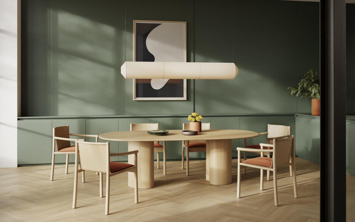  Milan Design Week Arper Ghia oval table in light wood with matching chairs. 