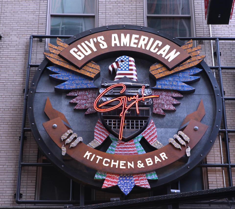 The exterior marquee for Guy's American Kitchen and Bar in Times Square, New York City.&nbsp; (Photo: Walter McBride via Getty Images)