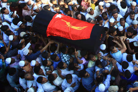 Supporters carry the coffin of Ko Ni, a prominent member of Myanmar's Muslim minority and legal adviser for Myanmar's ruling National League for Democracy, after he was shot dead, in Yangon, Myanmar January 30, 2017. REUTERS/Mg Nyi Nyi