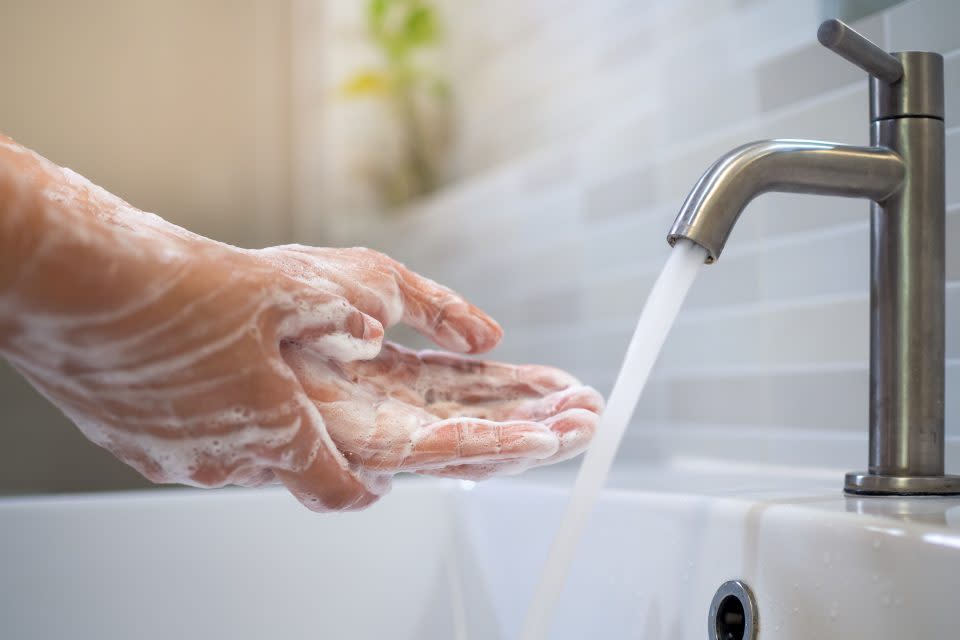 Wash hands with soap and wash with running water. Close up of women scrub hand soap with wash basin .The concept of hand hygiene and hand washing days around the world. Reducing infection Covit-19