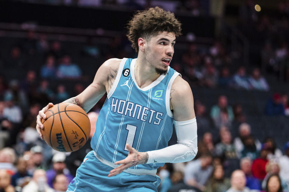 Charlotte Hornets guard LaMelo Ball brings the ball upcourt during the first half of an NBA basketball game against the Detroit Pistons in Charlotte, N.C., Monday, Feb. 27, 2023. (AP Photo/Jacob Kupferman)