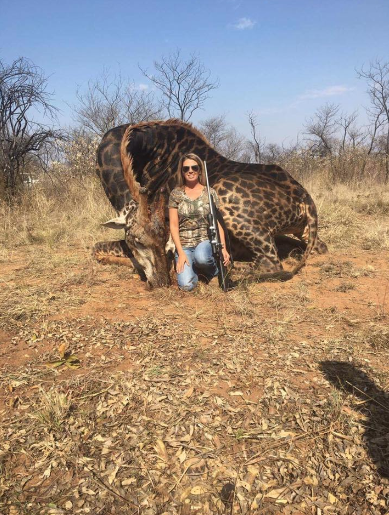 Photos of a female giraffe hunter posing for photos with her kill have made people angry. (Photo: Twitter/@africlandpost)