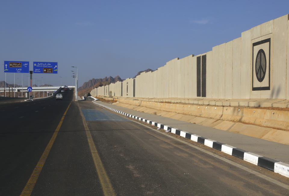 A peace sign adorns a concrete barrier that surrounds parts of the city of Sharm el-Sheikh, South Sinai, Egypt, Oct. 19, 2022. As this year’s United Nations climate summit approaches, Egypt’s government is touting its efforts to make Sharm el-Sheikh a more eco-friendly tourist destination. (AP Photo/Thomas Hartwell)