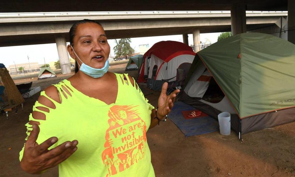 Under Highway 41 in downtown Fresno, homeless advocate Dez Martinez talks Thursday, Aug. 20, 2020, about the encampment she set up, named the Dream Camp by residents, to give homeless residents a safer and cleaner alternative to living on the streets. The camp operated for a year; Martinez closed it last fall.