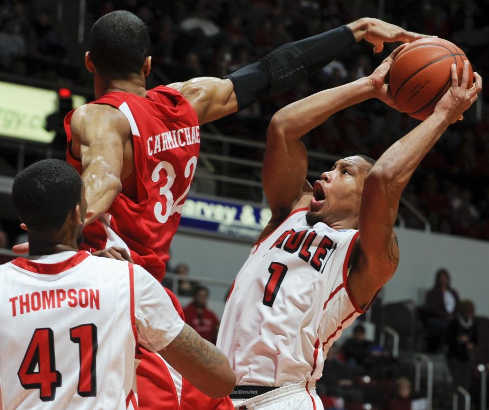 Bradley's Dyricus Simms-Edwards goes to the basket against Illinois State's Jackie Carmichael during this 2012 game at Carver Arena.