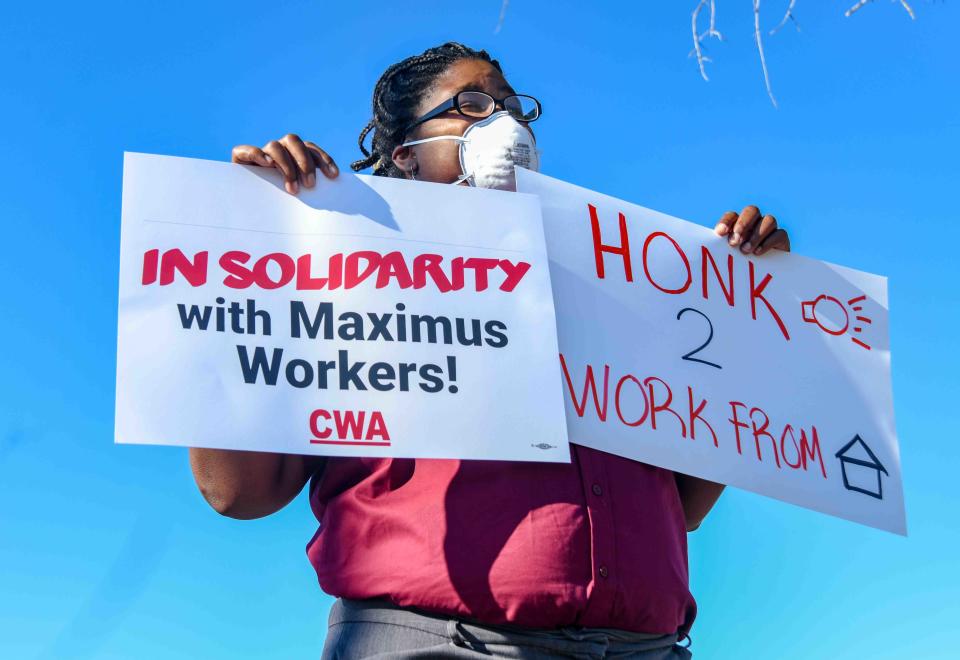 Tiandra Robinson, Communication Workers of America organizer, protests outside of the Maximus call center amid the coronavirus pandemic in Hattiesburg, Miss., Friday May 1, 2020.