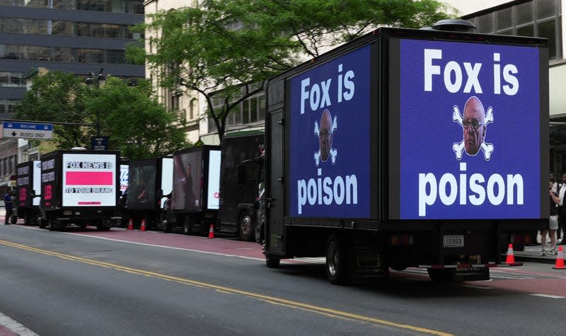 Billboard trucks from several protest groups lined the street in front of the Manhattan Center Monday during Fox New’s Upfront conference.