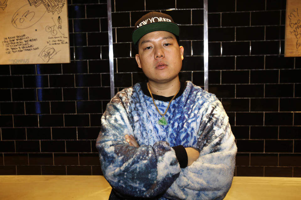 In this Monday, Jan. 28, 2013 photo, chef Eddie Huang poses for a portrait at his restaurant Baohaus in New York. Huang unveils a biting new memoir, "Fresh Off the Boat," about race, immigration, and, yes, food. (AP Photo/Seth Wenig)