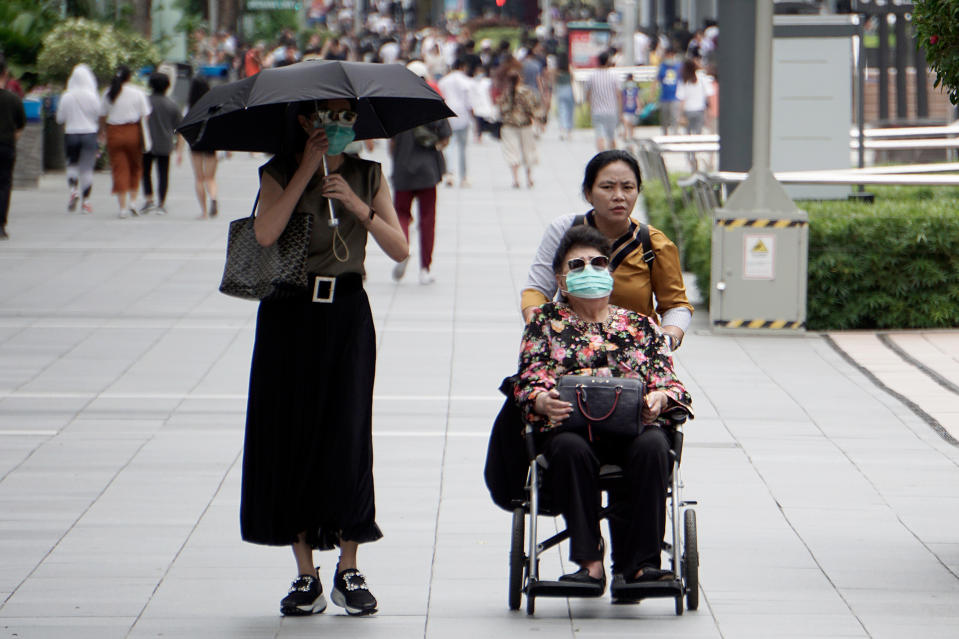 An elderly woman in a wheelchair seen in Orchard Road on 21 March 2020. (PHOTO: Dhany Osman / Yahoo News Singapore) 