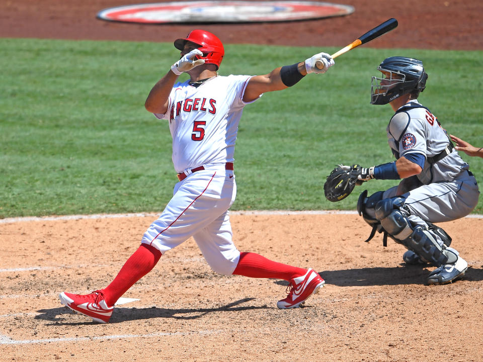 ANAHEIM, CA - AUGUST 02:  Albert Pujols #5 of the Los Angeles Angels hits a grand slam home run as Dustin Garneau #13 of the Houston Astros looks on in the third inning of the game of Anaheim on August 2, 2020 in Anaheim, California. (Photo by Jayne Kamin-Oncea/Getty Images)