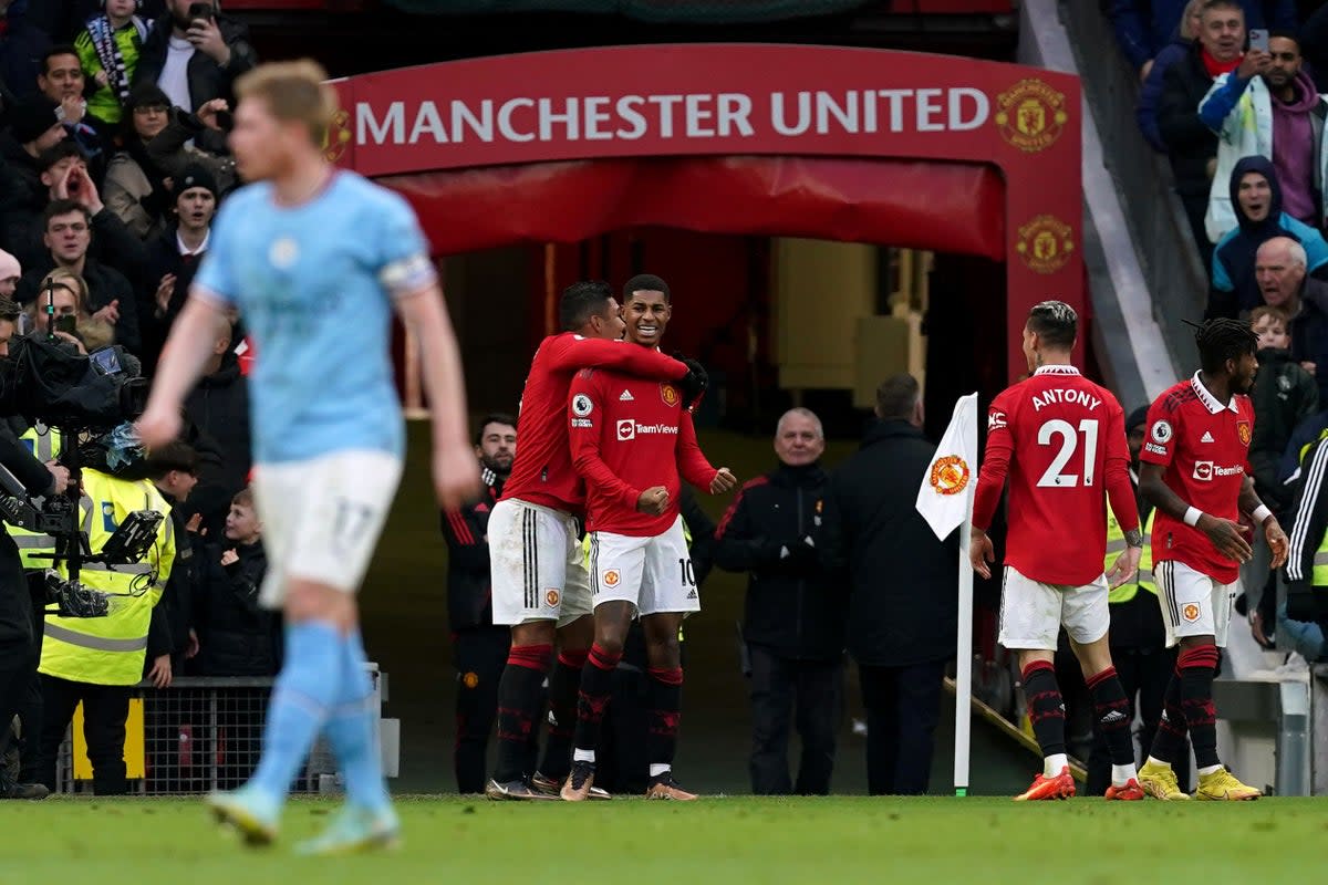 Marcus Rashford celebrates his derby winner (Martin Rickett/PA) (PA Wire)