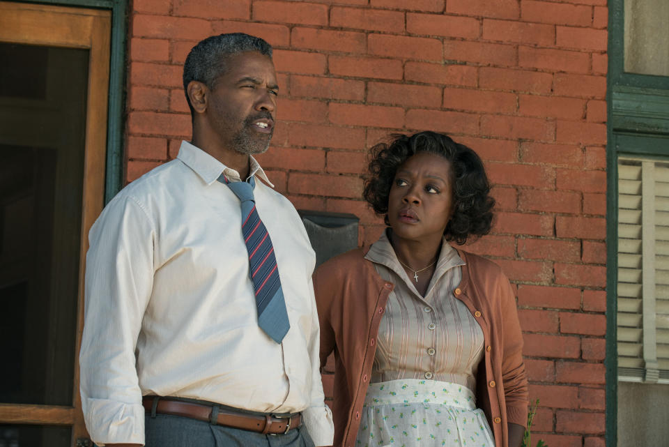 Denzel Washington and VIola Davis stand on a porch