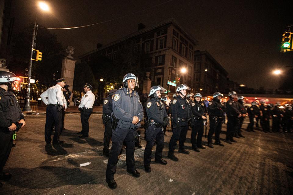 Hundreds of police officers stand outside Columbia University on April 30, 2024, as they get ready to rid the campus of protesters.