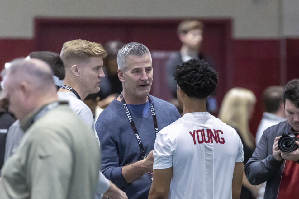 Carolina Panthers head football coach Frank Reich talks with former Alabama quarterback Bryce Young at Alabama's NFL pro day, Thursday, March 23, 2023, in Tuscaloosa, Ala. (AP Photo/Vasha Hunt)