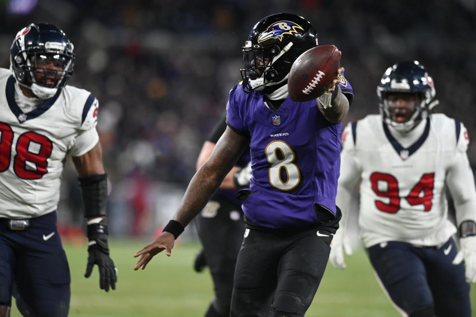 Lamar Jackson scores a touchdown during the divisional playoff win against the Houston Texans.