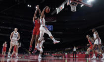 United States' A'Ja Wilson (9) and France's Endene Miyem (5) jump for a rebound during women's basketball preliminary round game at the 2020 Summer Olympics, Monday, Aug. 2, 2021, in Saitama, Japan. (AP Photo/Eric Gay)