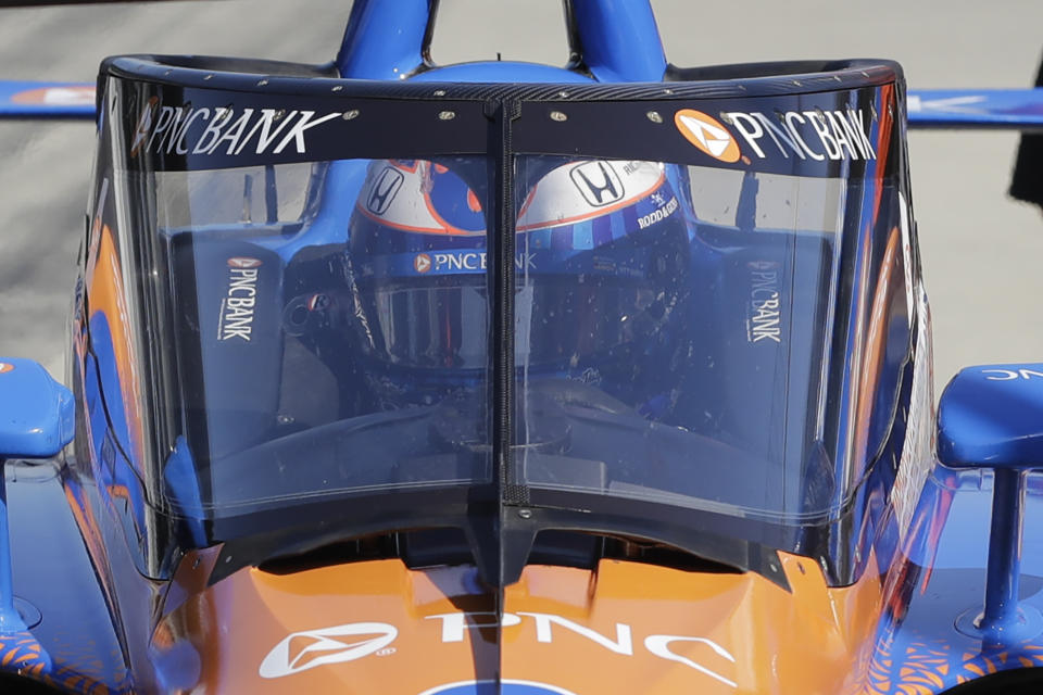 Scott Dixon, of New Zealand, sits in his car during the Aeroscreen testing at Indianapolis Motor Speedway, Wednesday, Oct. 2, 2019, in Indianapolis. (AP Photo/Darron Cummings)