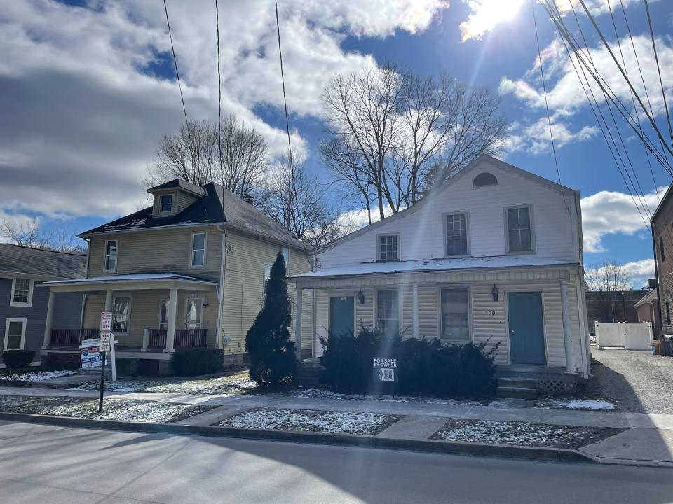 Two homes on East College Street in Granville are being sold by First Federal Savings and Loan after the bank has abandoned plans to demolishes both houses and create a parking lot.