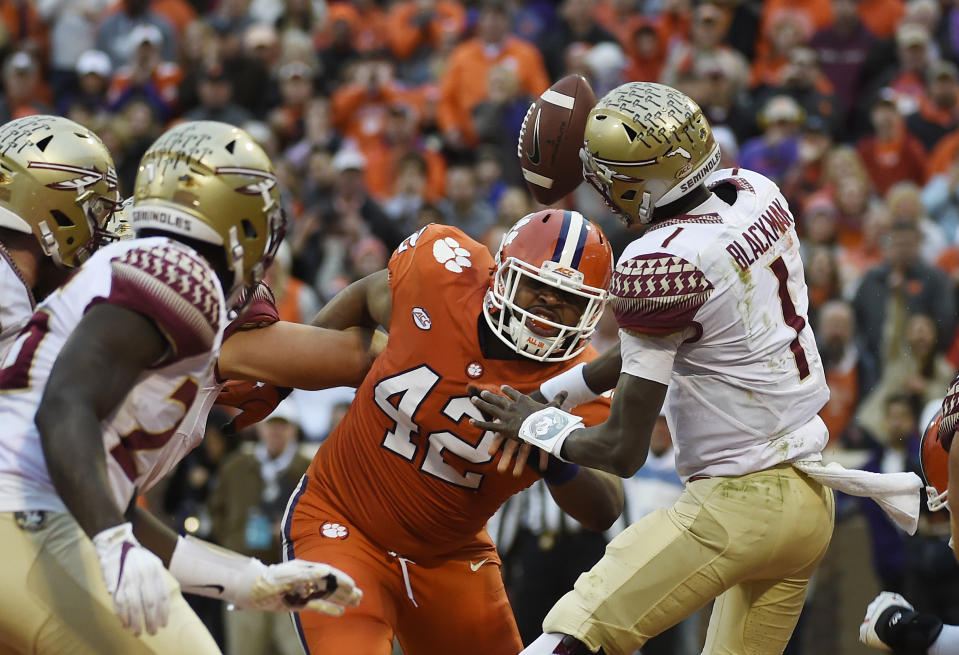 Clemson defensive lineman Christian Wilkins (42) blocks a pass from Florida State quarterback James Blackman (1) during the first half of an NCAA college football game, Saturday, Nov. 11, 2017, in Clemson, S.C. (AP Photo/Rainier Ehrhardt)