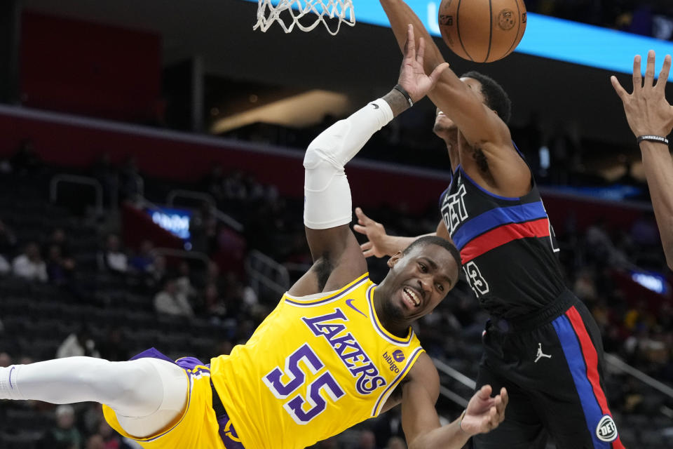 Detroit Pistons guard Jaden Ivey (23) knocks the ball away from Los Angeles Lakers forward Cam Reddish (5) during the second half of an NBA basketball game, Wednesday, Nov. 29, 2023, in Detroit. (AP Photo/Carlos Osorio)