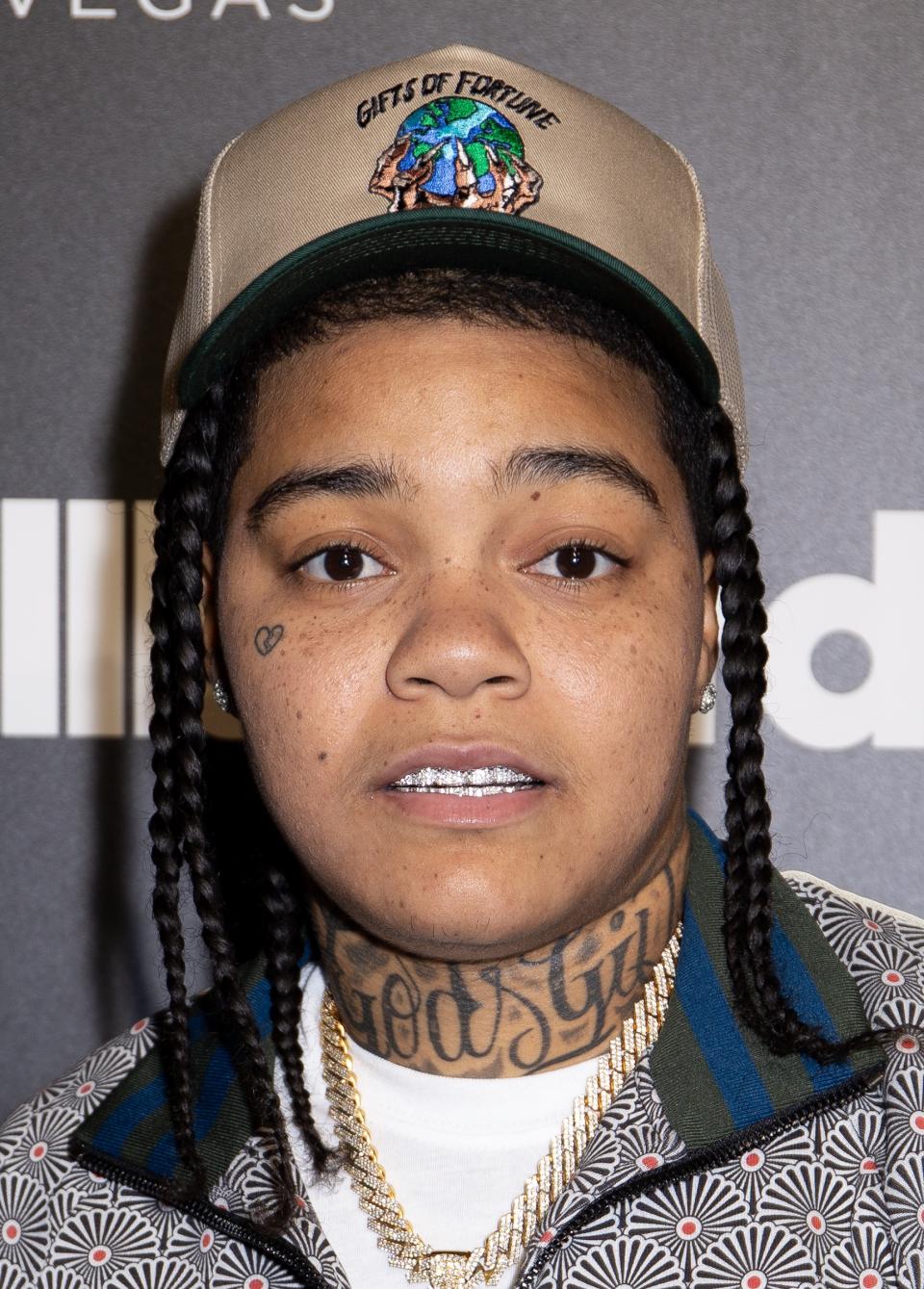 Young M.A posing for picture.
