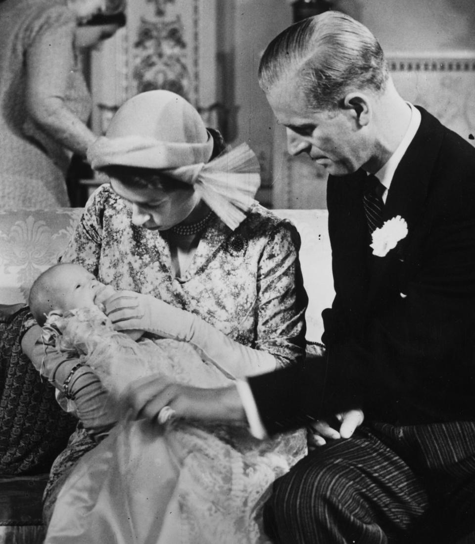 Princess Elizabeth and The Duke Of Edinburgh holding their baby daughter Princess Anne