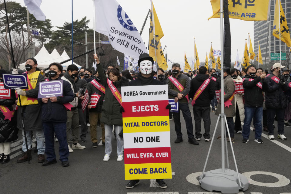 A doctors wearing a mask attend a rally against the government's medical policy in Seoul, South Korea, Sunday, March. 3, 2024. Thousands of senior doctors rallied in Seoul on Sunday to express their support for junior doctors who have been on strike for nearly two weeks over a government plan to sharply increase the number of medical school admissions. (AP Photo/Ahn Young-joon)