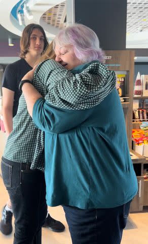 <p>MyHeritage.com </p> Angela Saucier (R) hugs her daughter Winona Nagy for the first time