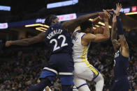 Golden State Warriors guard Jordan Poole (3) is fouled by Minnesota Timberwolves guard Patrick Beverley (22) during the second half of an NBA basketball game, Sunday Jan. 16, 2022, in Minneapolis. (AP Photo/Stacy Bengs)