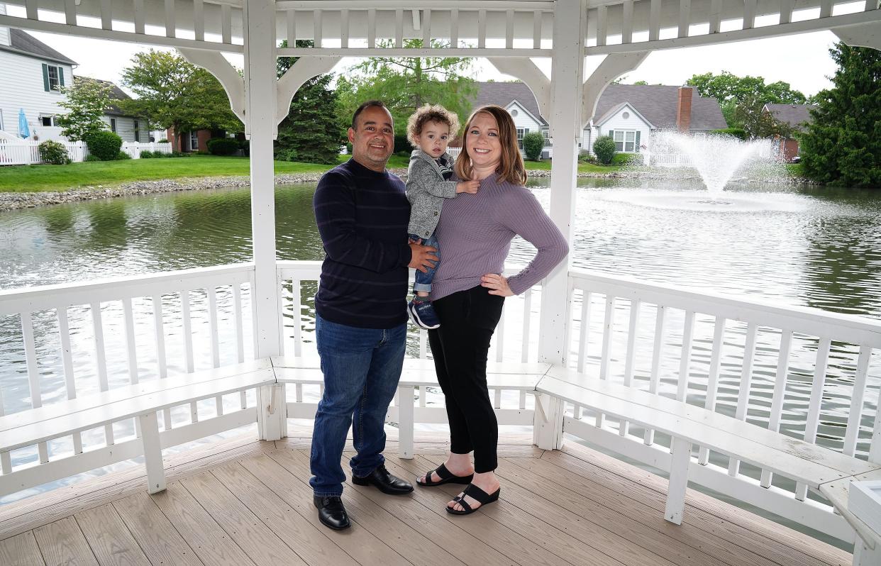 Meg Piasecki, right, and her partner, Ricardo Jimenez, left, traveled to Colorado for an abortion in 2018 after learning that the fetus had a chromosomal abnormality. It was too late into the pregnancy for her to seek an abortion in Ohio at the time. Today they have a 2-year-old son, Asher, center, and Piasecki is 18-weeks pregnant.