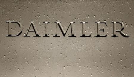 The Daimler AG sign with raindrops is pictured before the company's annual news conference in Stuttgart, Germany, February 4, 2016. REUTERS/Michaela Rehle