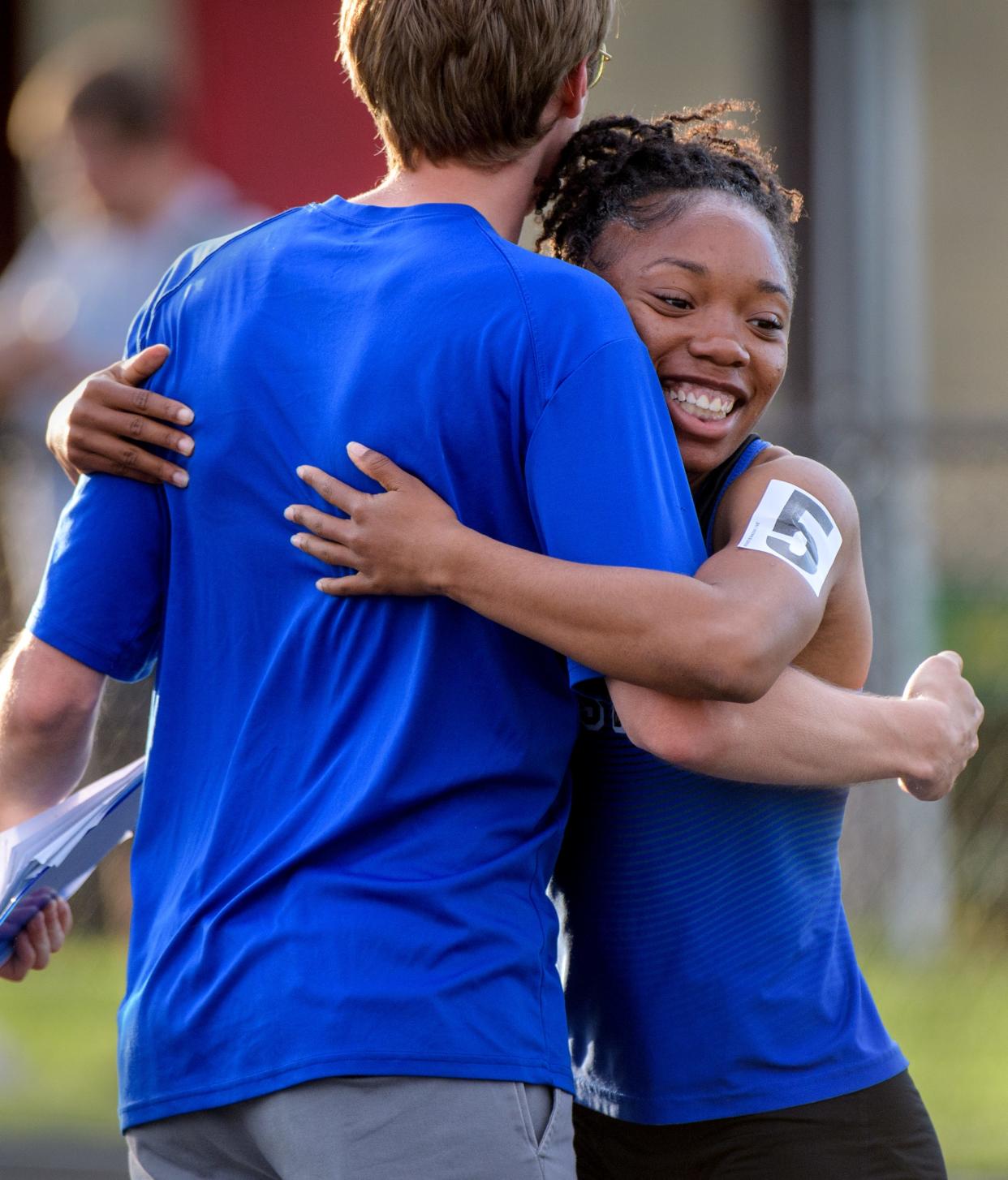 Limestone's Ranaisha Howard-Dunigan gets a hug in celebration of her victory in the 100-meter dash during the girls Class 2A sectional track and field meet Wednesday, May 8, 2024 at Metamora High School.
