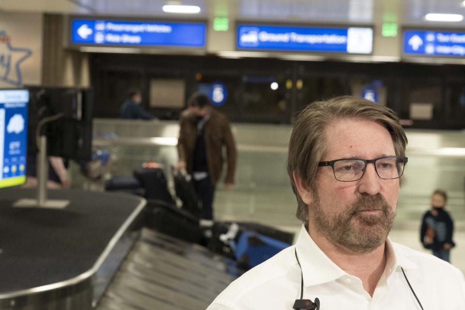 Trump supporter Jeff Zink, who visited a rally at the U.S. State capitol in Washington D.C., arrives at Phoenix Sky Harbor Airport on Jan. 8, 2021.