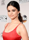 <p>Selena Gomez's simple curled ponytail is proof that a minimalist look can still stand out on a dancefloor of updos. </p> <p>Gomez's haistylist Nikki Lee added a few extra details to her pony like a slick center part and curled the tail to elevate the style for the red carpet. To get your hair as glossy as Gomez's, wash your hair with a shine boosting shampoo and conditioner combo like Pantene's Ice Shine Glacial Glossing Complex ($5 each; <a rel="nofollow noopener" href="https://www.walmart.com/ip/19529328" target="_blank" data-ylk="slk:walmart.com;elm:context_link;itc:0;sec:content-canvas" class="link ">walmart.com</a>). </p>