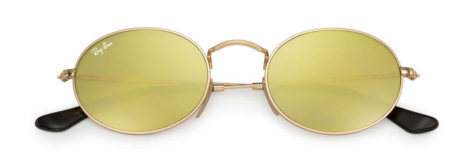 <p>Colorful Round Sunglasses with Oval Flat Lenses, $175, <a rel="nofollow noopener" href="http://www.ray-ban.com/usa/sunglasses/RB3547N%20UNISEX%20003-oval%20flat%20lenses-gold/8053672611625?category_Id=332648" target="_blank" data-ylk="slk:ray-ban.com;elm:context_link;itc:0;sec:content-canvas" class="link "><u>ray-ban.com</u></a>.</p>