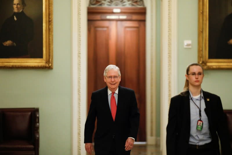 U.S. Senate Majority Leader McConnell enters the Senate Chamber Floor after Congress agreed to a multi-trillion dollar economic stimulus package created in response to the economic fallout from the COVID-19 Coronavirus, on Capitol Hill in Washington