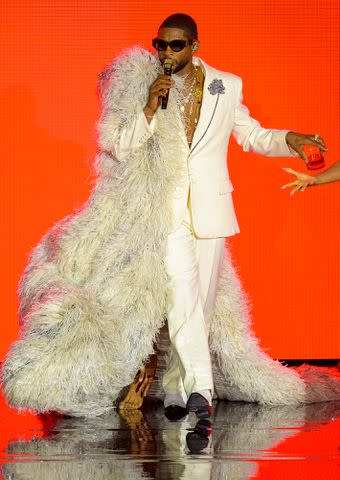 <p>Kristy Sparow/Getty Images</p> Usher performs during his residency at La Seine Musicale on September 25, 2023 in Boulogne-Billancourt, France.