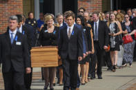 <p>The casket of Otto Warmbier is carried from Wyoming High School after his funeral, Thursday, June 22, 2017, in Wyoming, Ohio. (Photo: Bryan Woolston/AP) </p>